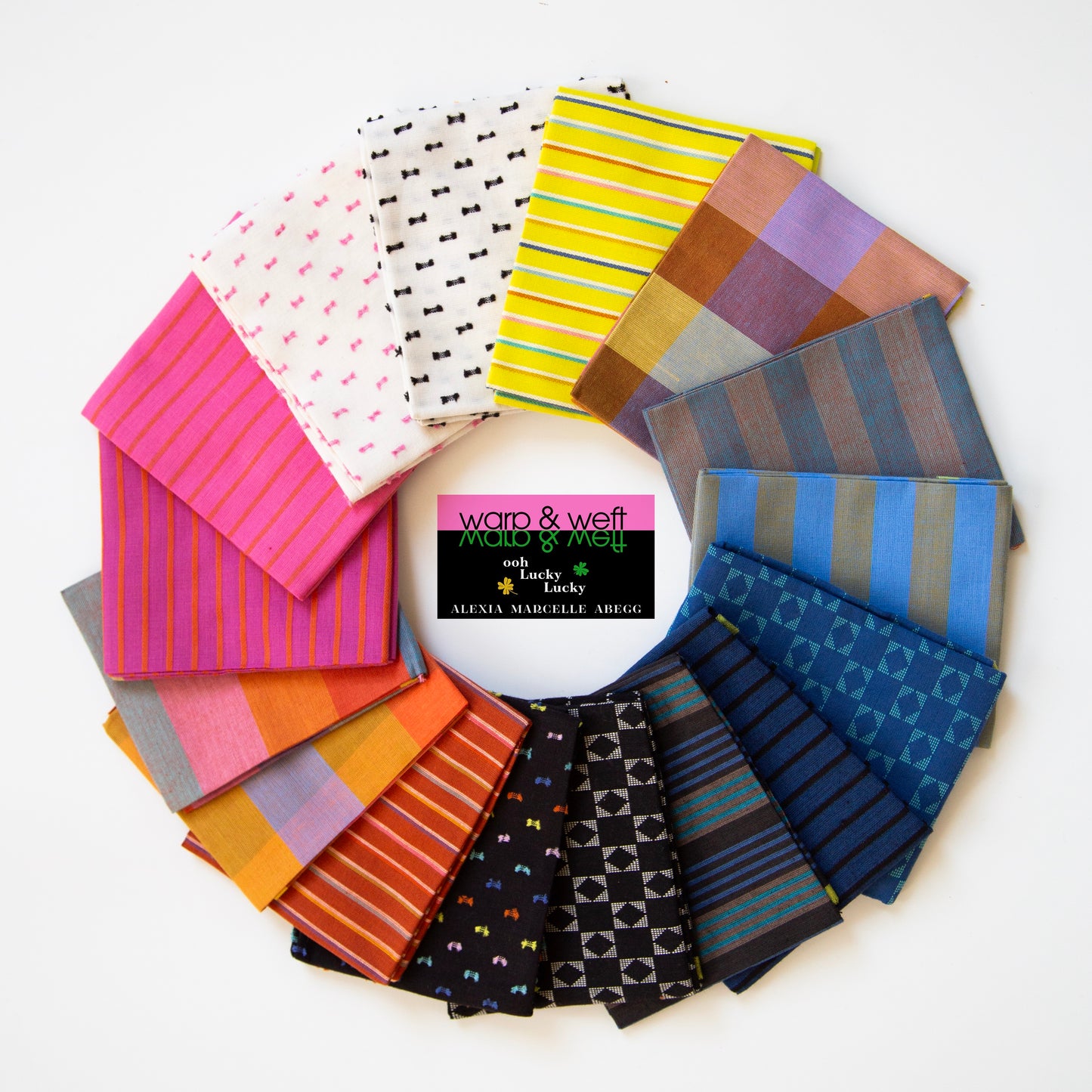 Warp and Weft, 16 different fabrics arranged in a circle. colors range from black to blue to orange to pink to white to yellow