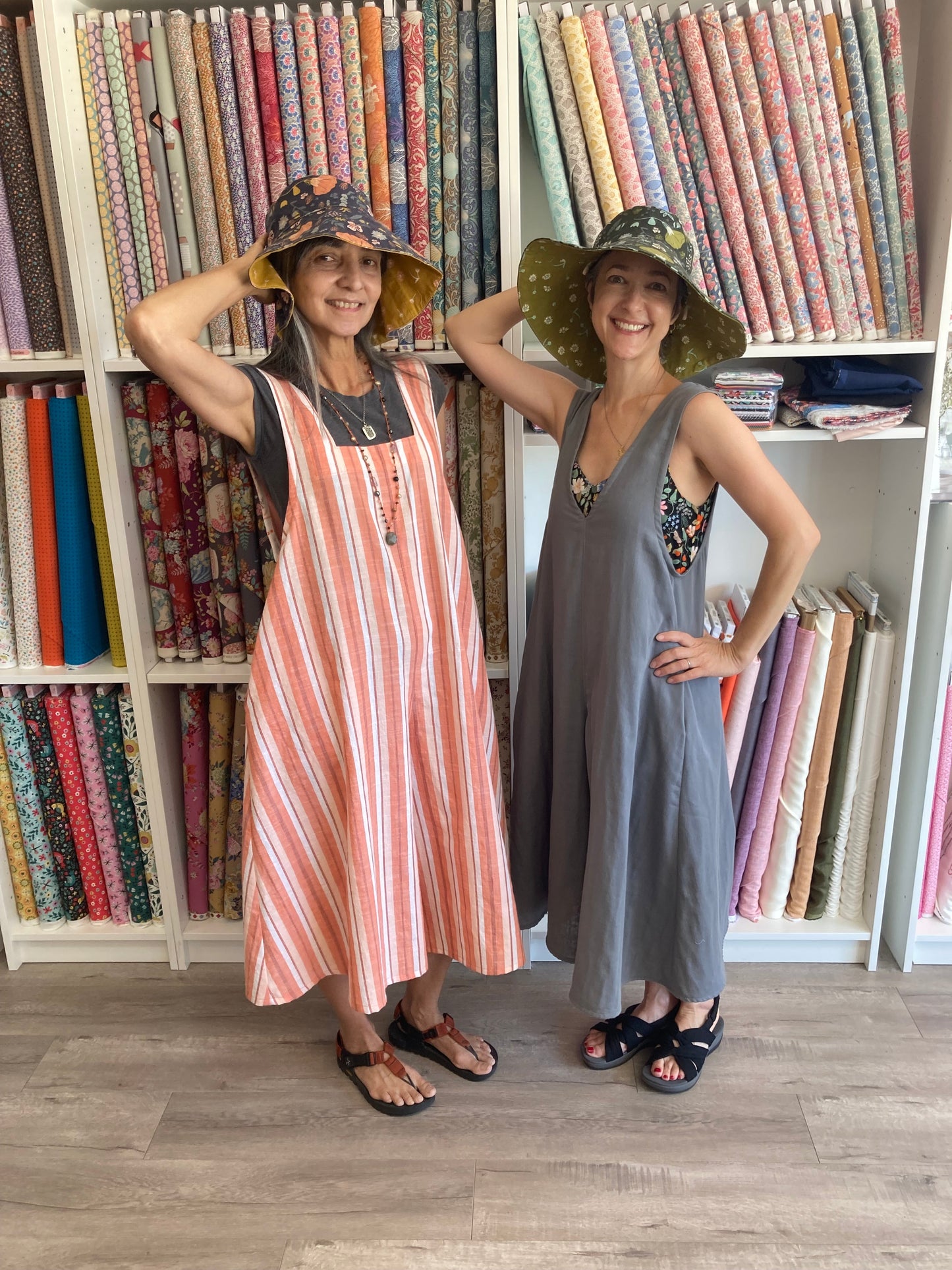 Darcy & Lana wear jumpsuits and hats
